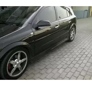 Бічні спідниці HB (під фарбування) для Opel Astra H 2004-2013рр